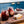 Load image into Gallery viewer, Close-up of a wooden platter that holds two glasses of non-alcoholic cocktails and a bowl of cherries.
