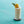 Load image into Gallery viewer, Close-up of a tall glass containing a crushed ice non-alcoholic mixed drink with a pineapple slice garnish.