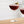 Load image into Gallery viewer, Close-up of two martini glasses containing cherry-red non-alcoholic mixed drinks with cherry and lemon garnishes.